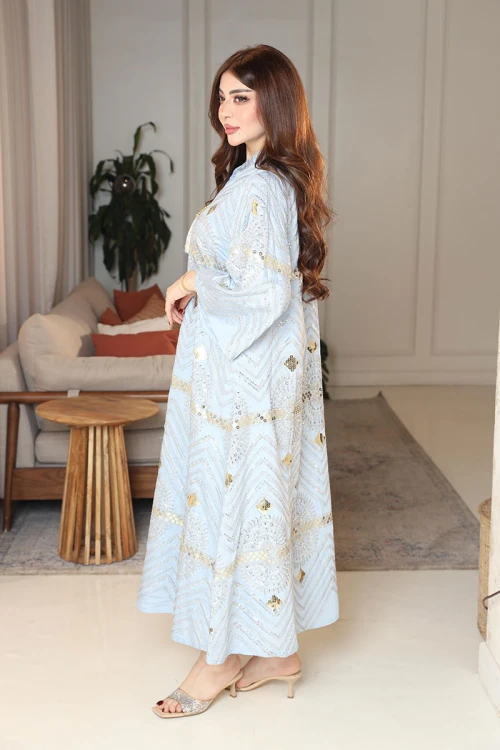 جلابية نسائية لون سماوي ياقة عالية بقصة سبعة مزينة بالترتر و تطريزات ذهبية و بأكمام طويلة