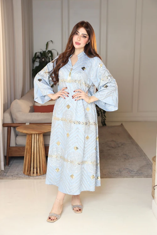 جلابية نسائية لون سماوي ياقة عالية بقصة سبعة مزينة بالترتر و تطريزات ذهبية و بأكمام طويلة