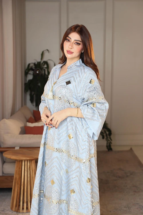 جلابية نسائية لون سماوي ياقة عالية بقصة سبعة مزينة بالترتر و تطريزات ذهبية و بأكمام طويلة
