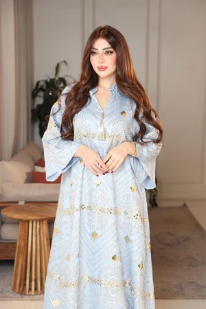 جلابية نسائية لون سماوي ياقة عالية بقصة سبعة مزينة بالترتر و تطريزات ذهبية و بأكمام طويلة 