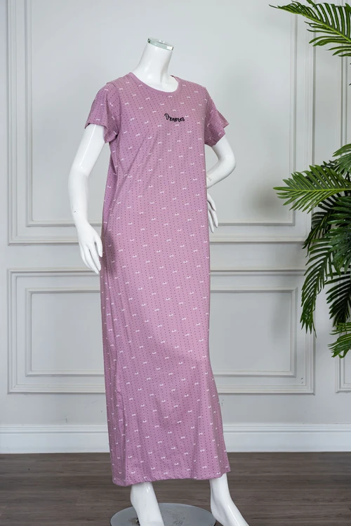 قميص نسائي طويل لون وردي منقط بياقة دائرية و بأكمام قصيرة