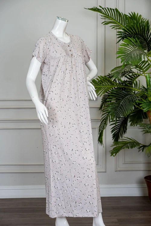 قميص نسائي طويل لون بيج مشجر ياقة دائرية بأزرار من الأمام و بأكمام قصيرة