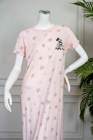 قميص نسائي طويل لون خربزي مزين بكتابات و رسومات ياقة دائرية و بأكمام قصيرة