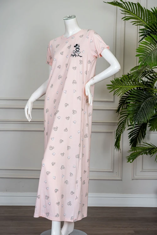 قميص نسائي طويل لون خربزي مزين بكتابات و رسومات ياقة دائرية و بأكمام قصيرة