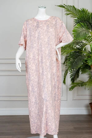 قميص نسائي طويل لون خربزي مزين برسومات ياقة دائرية و بأكمام قصيرة