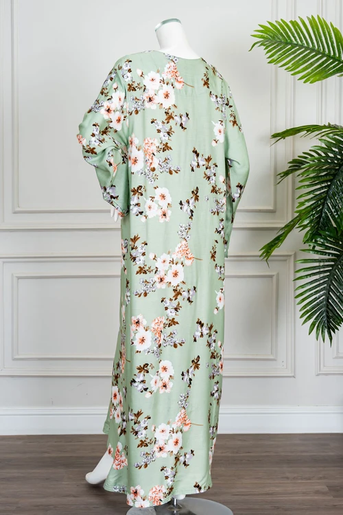 قميص نسائي طويل لون تفاحي مشجر ياقة دائرية بأزرار من الأمام و بأكمام طويلة