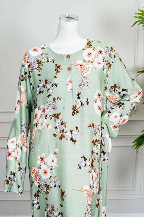 قميص نسائي طويل لون تفاحي مشجر ياقة دائرية بأزرار من الأمام و بأكمام طويلة