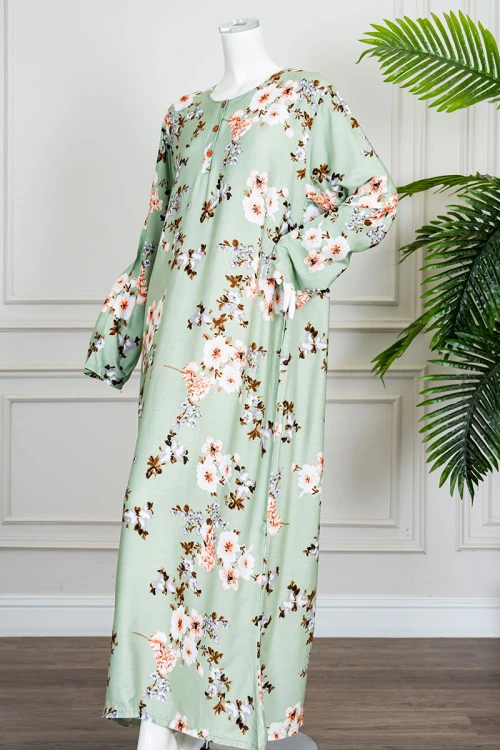 قميص نسائي طويل لون تفاحي مشجر ياقة دائرية بأزرار من الأمام و بأكمام طويلة